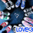 Pixelated image with blue, white, and pink elements surrounding a central dark shape; bottom-right corner displays 'LOVE=' in bold blue text on light background.