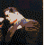 Superman in blue and red costume with orange 'S' shield, transitioning from side profile to back view against dark background.