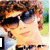 A four- of pixelated celebrity images with text overlays, showing a person in sunglasses and three group shots on pink background