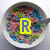 A bowl of colorful cereal with a spoon, featuring changing text overlays across four