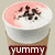 Three coffee drinks with whipped cream toppings and 'YUMMY' text labels on brown bands.