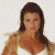 A pixelated image of a person with long brown hair wearing a white top, positioned next to green text on a dark background.