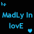 Pixelated blue text on black background with heart symbols and a small inset image of skin with red marks.