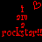 Red pixelated text and symbols on black background, featuring 'i', 'am', 'a', 'rockstar!!' with a heart symbol above the first 'i'.