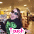 A person in a black shirt with green pattern sits on a golden couch, smiling while text overlays change sequentially.