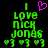 Green pixelated text reads 'I Love Nick Jonas' with a pink heart above and three green hearts below on black background.