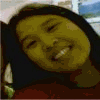 A person with dark hair and a red top appears in a of showing sequential text changes below the image