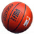 A pixelated red basketball with black lines and a white patch, featuring partially legible dark text on its surface.
