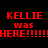 Red and green pixelated text on black background with 'KELLIE' repeated, 'was', and multiple exclamation marks in a