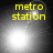 Yellow text 'metro station' appears above a bright white light source that shifts position across four , with small dots and faint circular shapes visible in the background