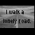 Animated contact sheet of 18 frames showing repeated text "I walk a lonely road." on gray backgrounds with vertical white lines, arranged in a 5x4 grid with one empty cell.