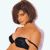 Pixelated static image of a woman with brown hair wearing a black strapless top, viewed from the shoulders up against a white background.