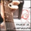 A close-up of a guitar neck with fingers pressing strings, overlaid text reading 'music is everything', and red circular symbols in the background.