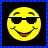 A 48x48 pixel buddy icon split into two sections: a yellow smiley face with sunglasses on the left and blue text reading "I Love Smiles!" on an orange starry background on the right.