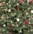 A pixelated static image of a green tree with scattered red and white circular ornaments.