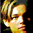 Pixelated image of a person with light brown hair and dark clothing on the left, next to blue background text reading 'Died in the Atlantic, yet still so hot...' in cyan.