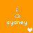 Pixelated orange background with four identical white text blocks reading 'i <3 sydney' and two heart symbols in light pink and peach tones.