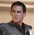 Static pixelated image of a person in dark clothing against horizontal striped background with visible dithering and anti-aliasing artifacts.
