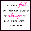 Two side-by-side animated frames of a pixelated text-based buddy icon with pink and black lettering on white background, showing slight heart symbol changes between frames.