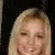 A person with long blonde hair wearing a red sleeveless top and dark pants, shown in multiple cropped views.