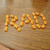 Golden pixelated text 'RMD' on a brownish gradient background with subtle horizontal banding.