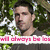 Pixelated image of a person with dark hair and light skin, wearing a dark shirt, standing against a green foliage background with pink text overlay.