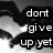 Black-and-white pixelated image with text 'dont give up yet' overlaid on abstract grayscale background shapes.