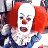 Pixelated image of a clown with white face paint, red nose, and red hair wearing blue clothing.
