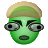 Green-skinned character with light brown cap, large gray eyes, and dark mouth, shown in two side-by-side frames with eye position differences.