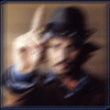 A nine- shows a person adjusting glasses with one hand, transitioning from blurred to sharp focus