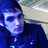 A pixelated image of a person in a dark blue jacket with a light-colored background, accompanied by blue text reading "So Pure So Cute I love Mikey And Thats Life" on a black background.