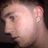 A person's profile view with short hair and an earring, shown in four with slight head position changes and a gray in the bottom right