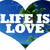 Blue heart-shaped icon with white text "LIFE IS LOVE" over a tropical background featuring palm trees and a clear sky.