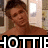 A shirtless man with short brown hair appears in three distinct poses against a blurred indoor background, with the word "HOTTIE" overlaid in bold black and white text.