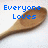 A wooden spoon with blue pixelated text reading 'Everyone Loves' on the left and 'The Discipline Spoon!!!' on the right against a white background.