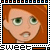 Two pixelated cartoon faces side-by-side in a filmstrip border, one with red hair and green eyes on orange background, the other blue-skinned character with wide eyes on purple background.