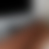 A static image with a gradient background transitioning from dark gray to light gray to brown, showing no distinct subjects or objects.
