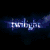 Animated sequence showing four distinct scenes: a blue 'twilight' text on dark background, two people embracing, a person lying in grass, and multiple figures with 'Twilight' text.