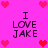 Pixelated pink background with four identical text blocks reading "I LOVE JAKE" surrounded by red and pink heart icons.