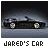 Pixelated image of a dark convertible car with headlights on, positioned horizontally against a gradient background, labeled 'JARED'S CAR' below.