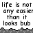 Pixelated text repeats across a white background with gray terrain-like borders, showing identical static frames.