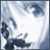 Pixelated blue and white abstract shape with dark blue accents on a light background, no visible text or distinct subjects.
