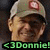 Pixelated image of a person wearing a light-colored cap with red circular emblem, green accents on the cap, and dark hair visible beneath it.
