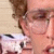 Animated contact sheet of a person with curly hair and glasses showing sequential text changes from "~" to "Frichen hott!" across 7 frames.
