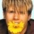 Static pixelated image of a person with light brown hair, closed eyes, and a yellow circular shape covering the lower face.
