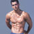 Static pixelated image of a shirtless muscular man with dark hair and blue shorts against a solid light gray background, rendered in low-resolution style typical of early 2000s instant messaging icons.