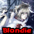Pixelated image of a person with light-colored hair and dark clothing against a blurred background, featuring red text at the bottom.