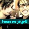 Two people with dark hair and glasses appear in a static image with a teal banner displaying text at the bottom.