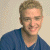 A 50x50 pixel animated contact sheet showing two frames: a person in a blue shirt on the left and green text reading "Original Icons .com" on the right against a dark background.