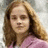 A static image of a person with long brown hair wearing a pink top, surrounded by pixelated pink text on a white background.